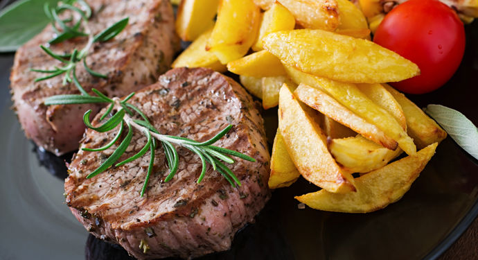 tender-juicy-veal-steak-medium-rare-with-french-fries.jpg